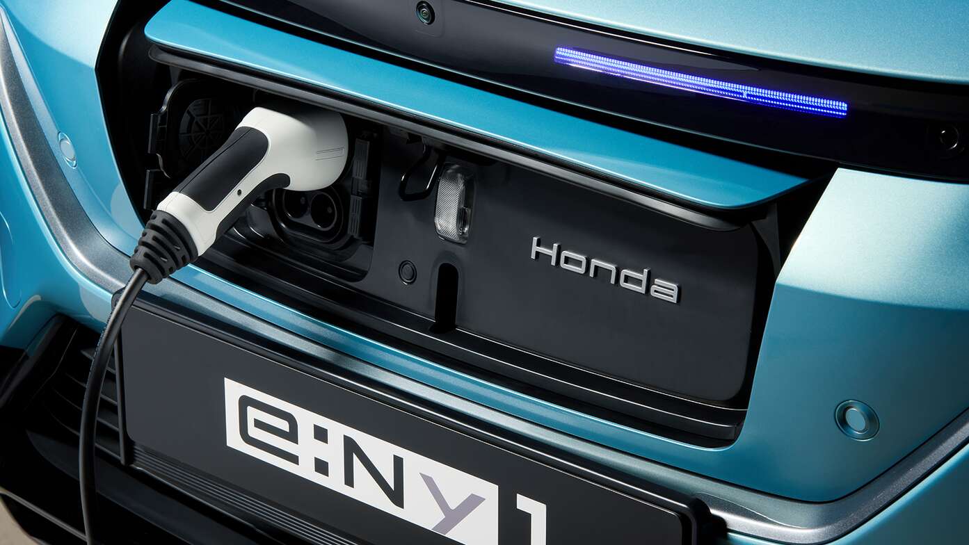 Close up of Honda e:Ny1 Easy-access charging port at the front of the car.
