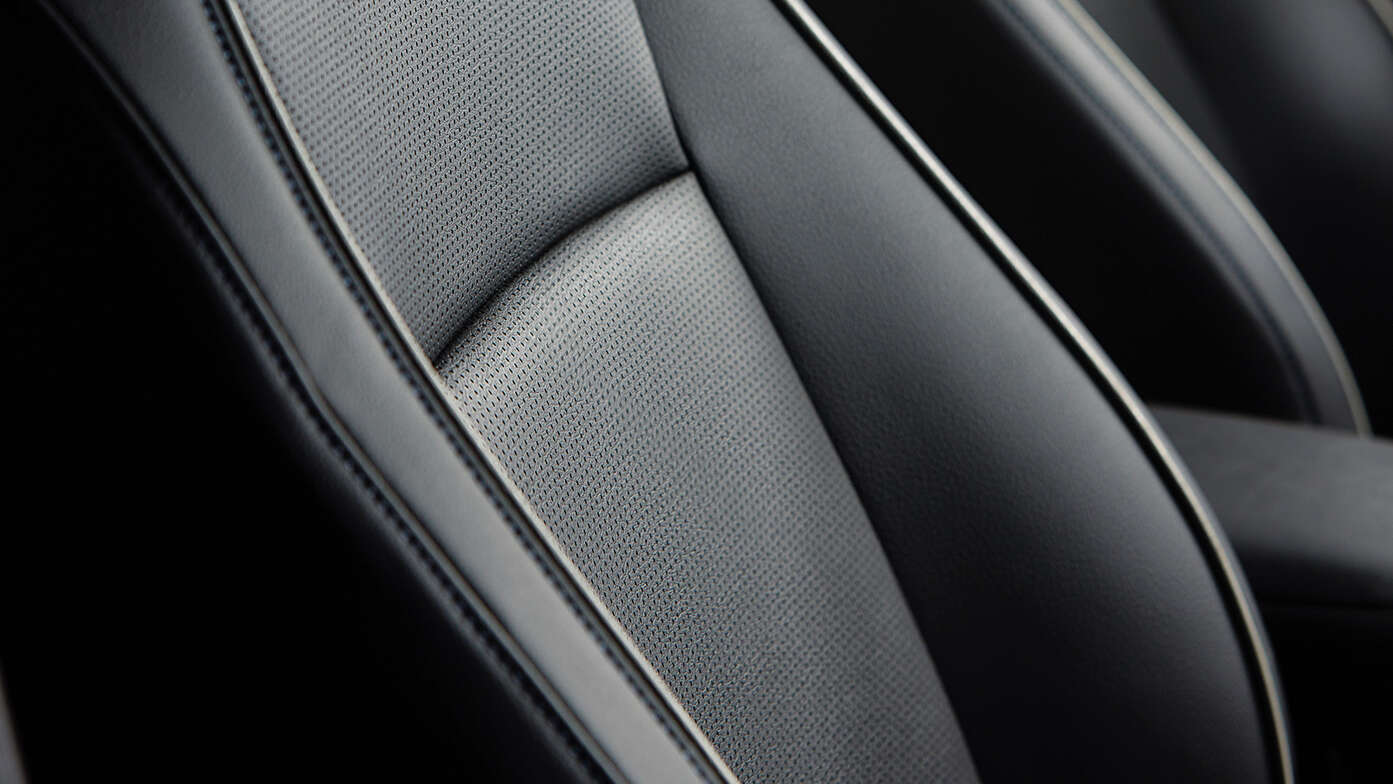 Close up of Honda e:Ny1 ergonomic seat in synthetic leather.