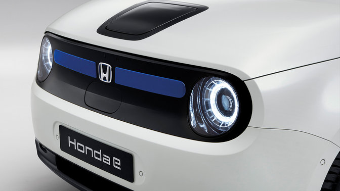 Left view close up of font lights and registration plate