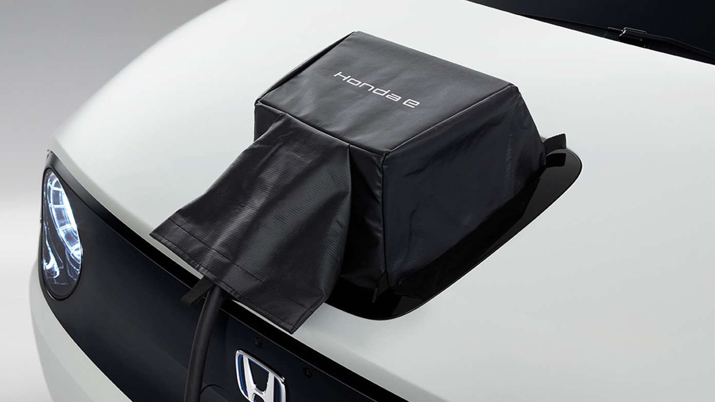 Close up of Honda E Power Charge port lid cover.