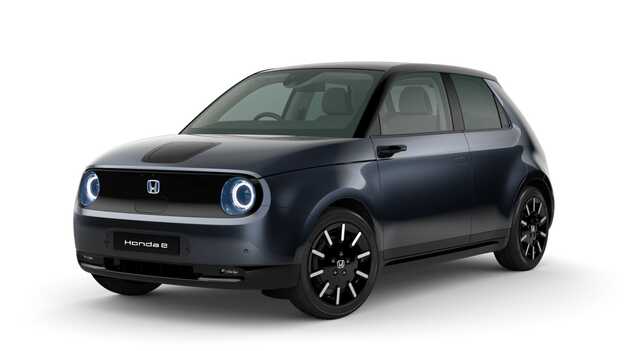 Meteoroid grey metallic Honda e Side facing three quarter.
