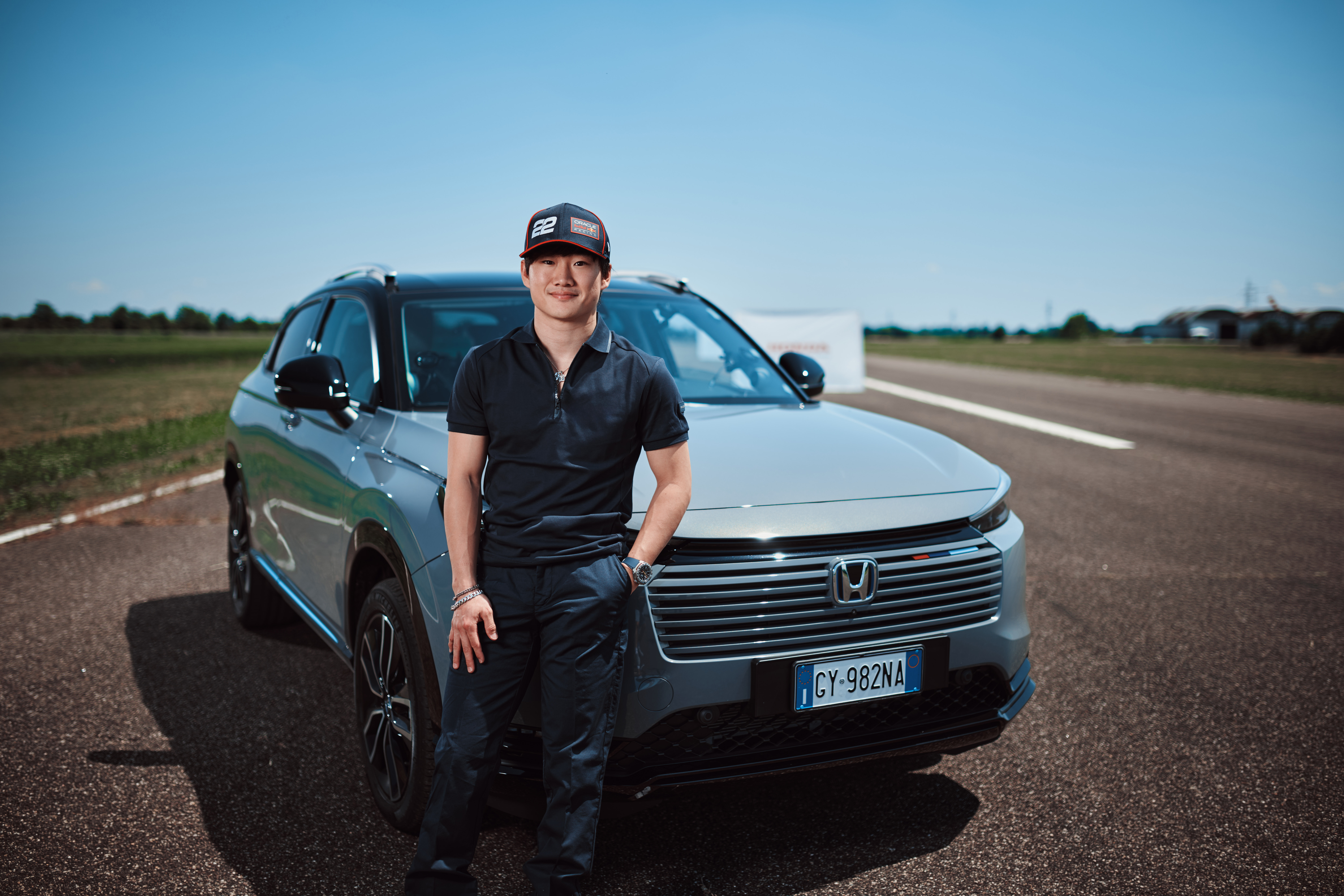 Yuki standing next to the front grille of the HR-V