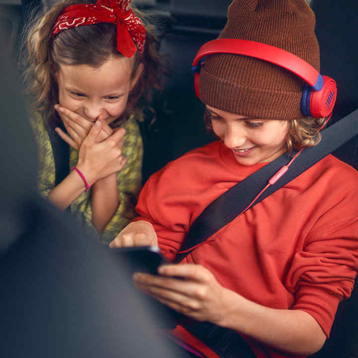 Rear seats in Honda HR-V with two children playing games.
