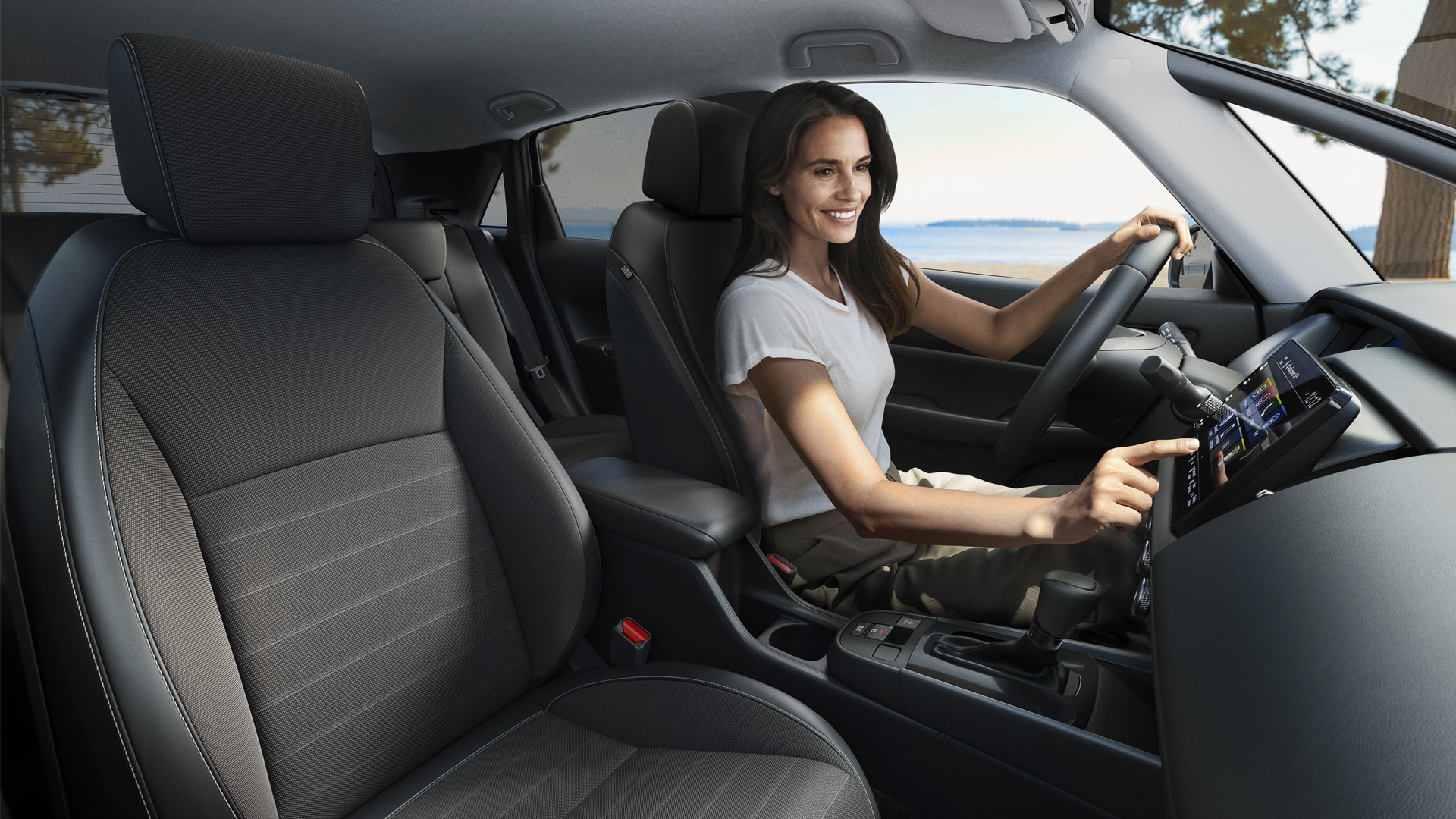 Front 3/4 Jazz Crosstar driving in a coastal location.