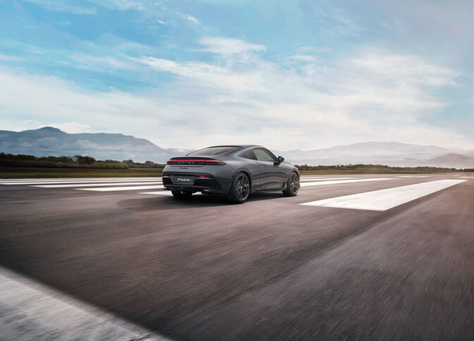 Back 1/4 facing image of a Honda prelude in Grey on a runway strip. 