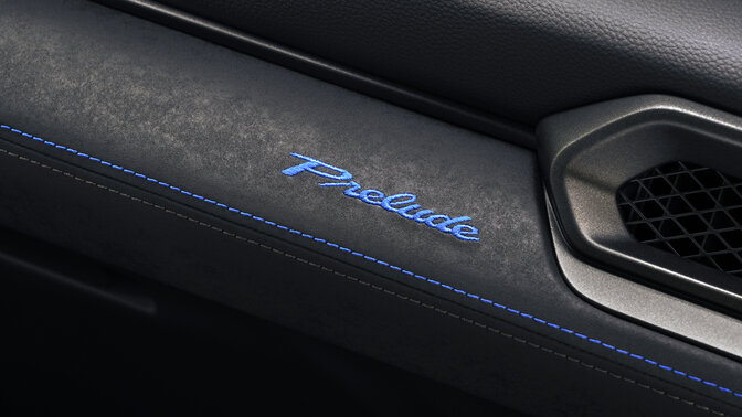 Prelude logo stitched.