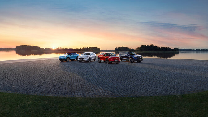 Honda SUV vehicles parked by a lake