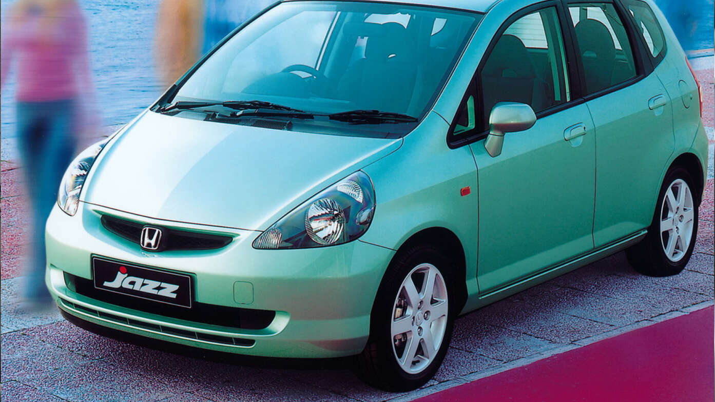 Front three-quarter facing Honda Jazz, seaside location.