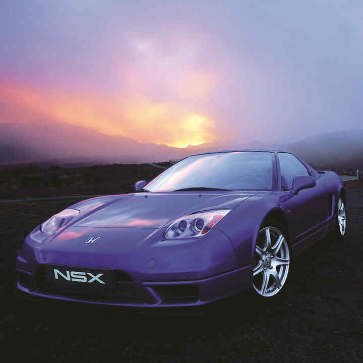 Front three-quarter facing Honda NSX at sunset.