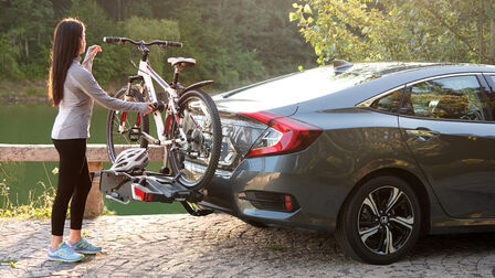 Close up of Honda Civic 4 door with bicycle carrier.