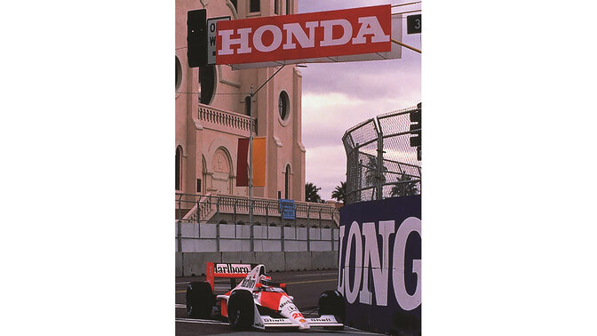 Front three-quarter facing McLaren Honda Formula One car, racing around the track.