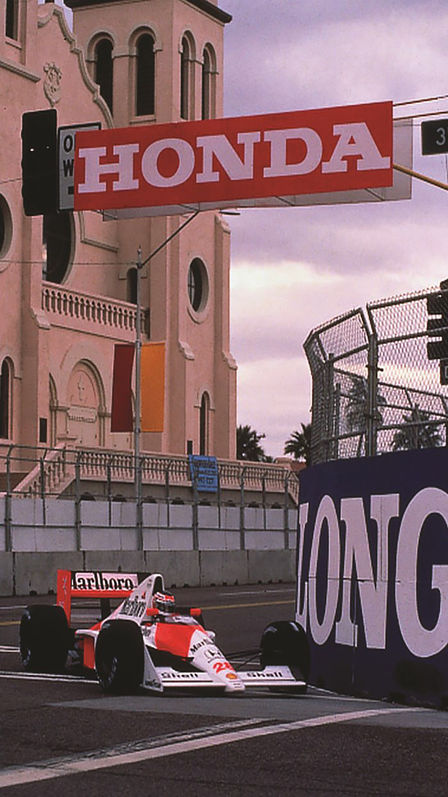 Front three-quarter facing McLaren Honda Formula One car, racing around the track.