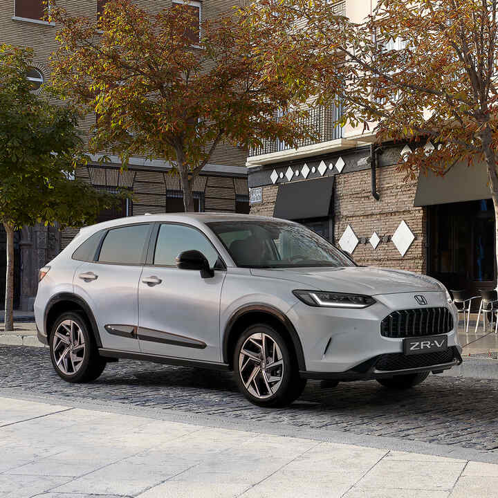 Front three quarter Honda ZR-V with premium black  pack in city location.