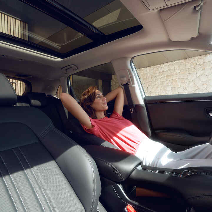 Woman reclining in seat