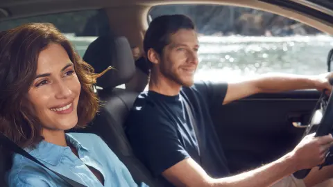 Couple enjoying driving in the Honda ZR-V Hybrid Front seats.