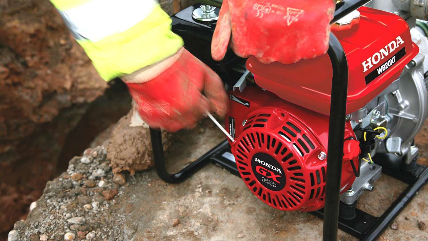 Close up of Honda GX engine in high flow rate water pump being used by a model.