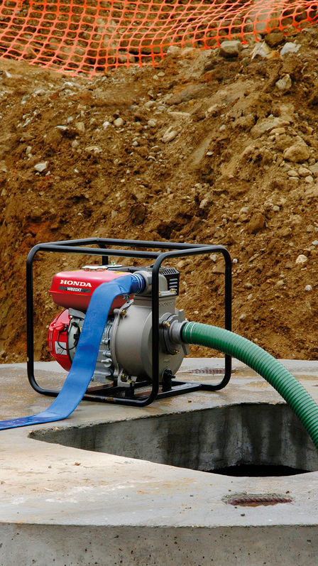 Close up of high flow rate water pump on a building site.