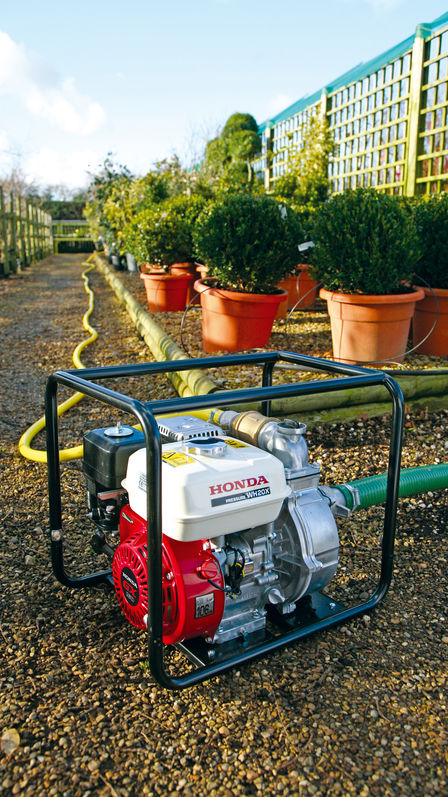 High pressure water pump being used in a garden centre
