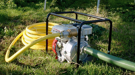 High Pressure water pump with GX series 4 stroke engine outdoors - side view.