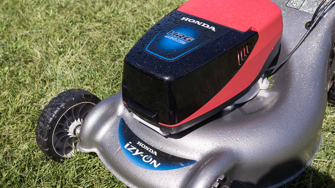 front side view of honda cordless izy-on electric lawnmower on lawn