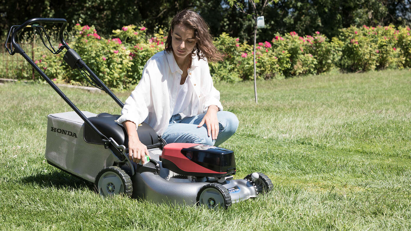 Women changing the dials on the IZY-ON