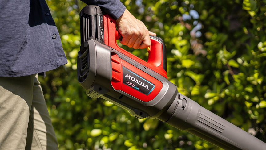 Man holding and using a leafblower