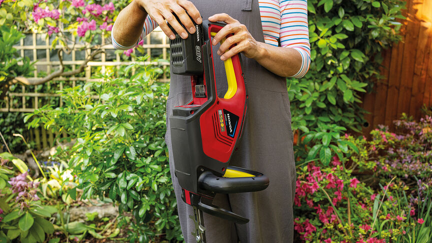 Man holding and using a leafblower