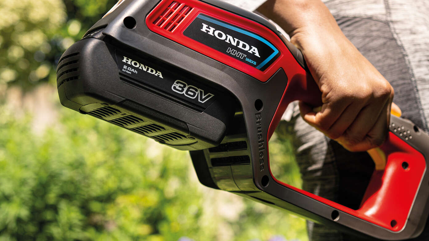 Close up rear view of Honda Cordless lawntrimmer in garden location.