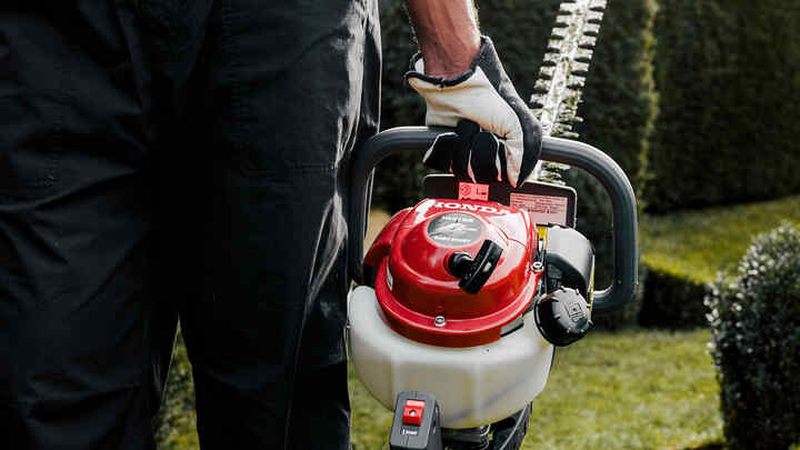 Man holding hedgetrimmer