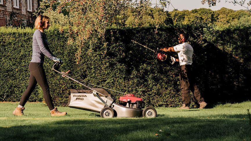 Front three quarter Honda IZY working on the lawn