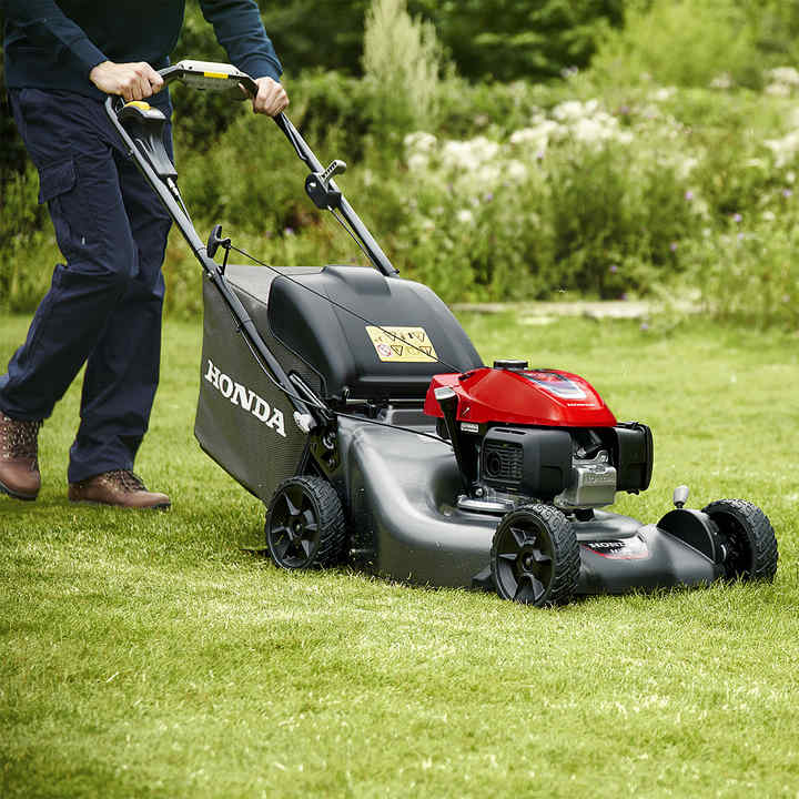 HRN petrol lawn mower mowing the grass.
