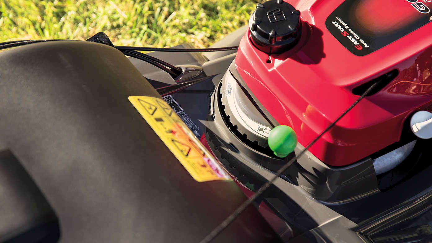close-up view of honda hrx 476 petrol lawnmower engine