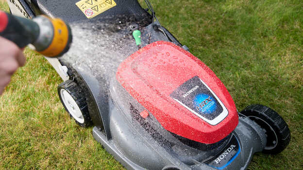 Close up of Honda HRX being sprayed with water. 