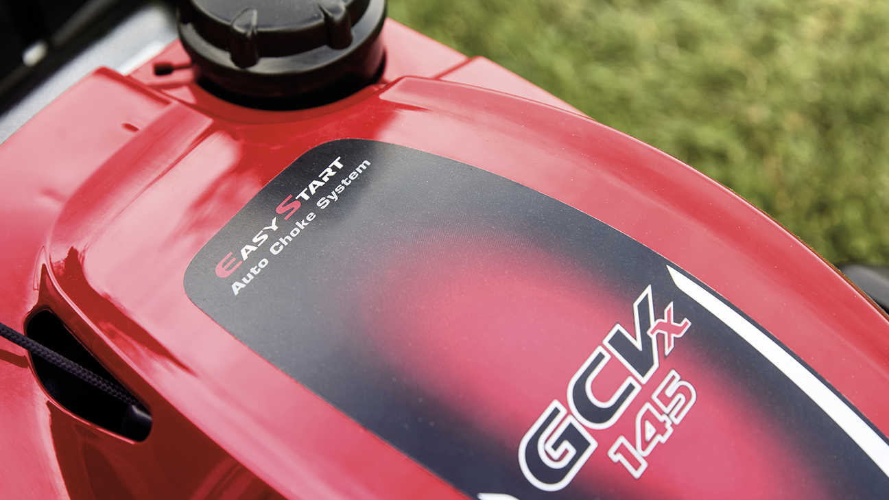 close up of top of honda izy petrol lawnmower with easy start auto choke system