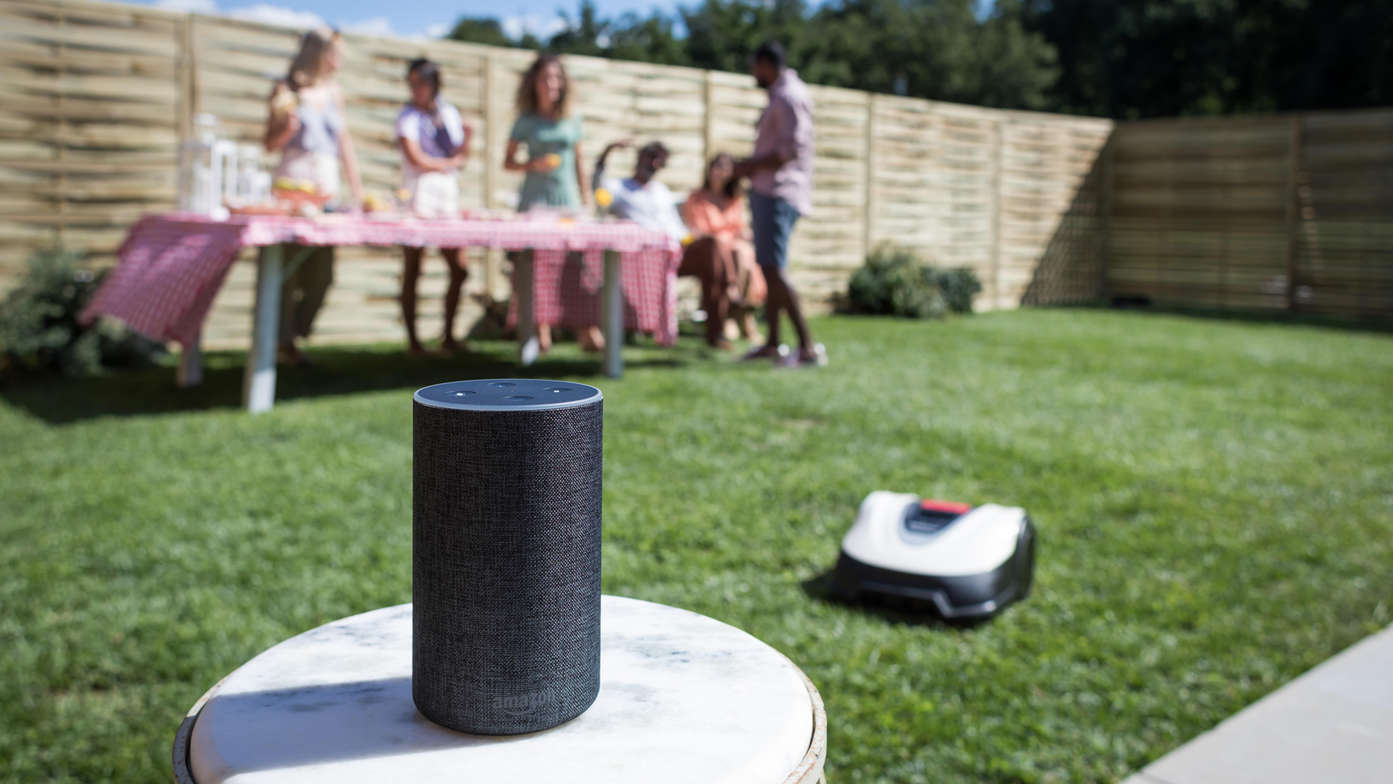 Miimo working on the lawn with Amazon Alexa in front.