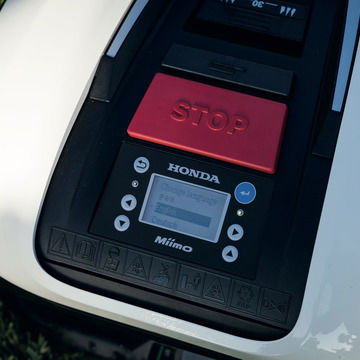 Close up of Honda Miimo display and stop button.