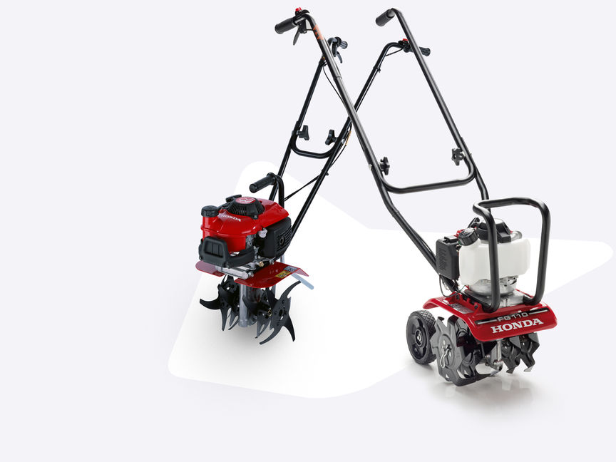 2x Honda Microtillers with different attachments.