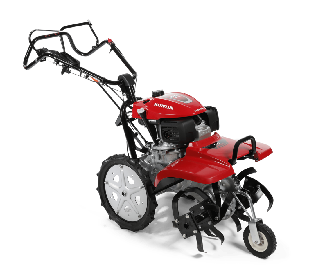 Rotary tiller, being used by model, garden location.