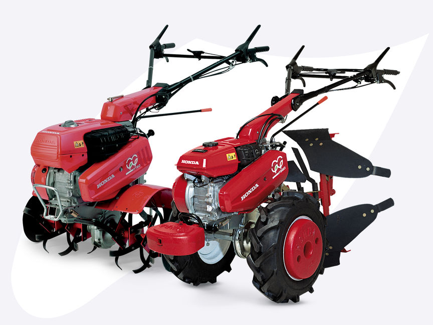 2x Honda Versatile Tillers, front-three quarter, left facing.