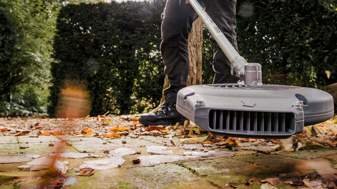 Versatool being used to blow leaves