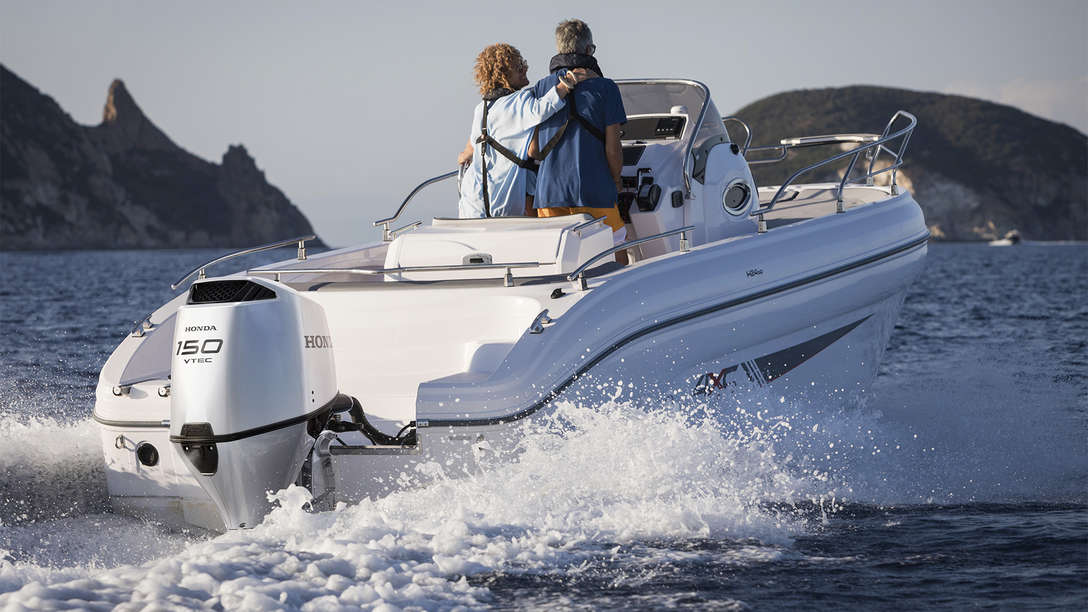 Boat with BF150 engine, being used by models, coastal location.