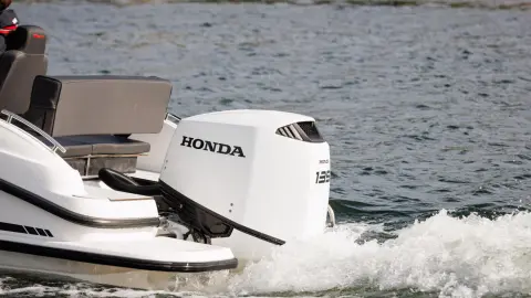Couple on boat with Honda BF135 engines.
