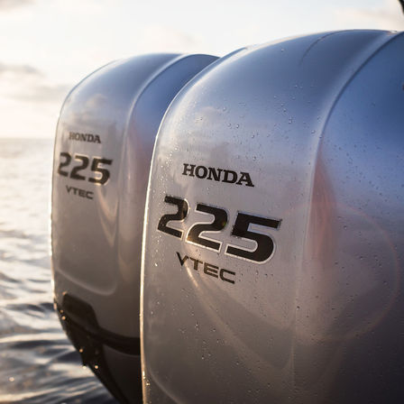 close up of two 225 horsepower vtec honda marine engines