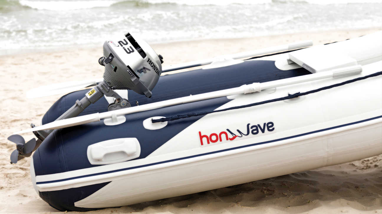 side view of honwave inflatable parked on the beach with honda bf 2.3 marine motor