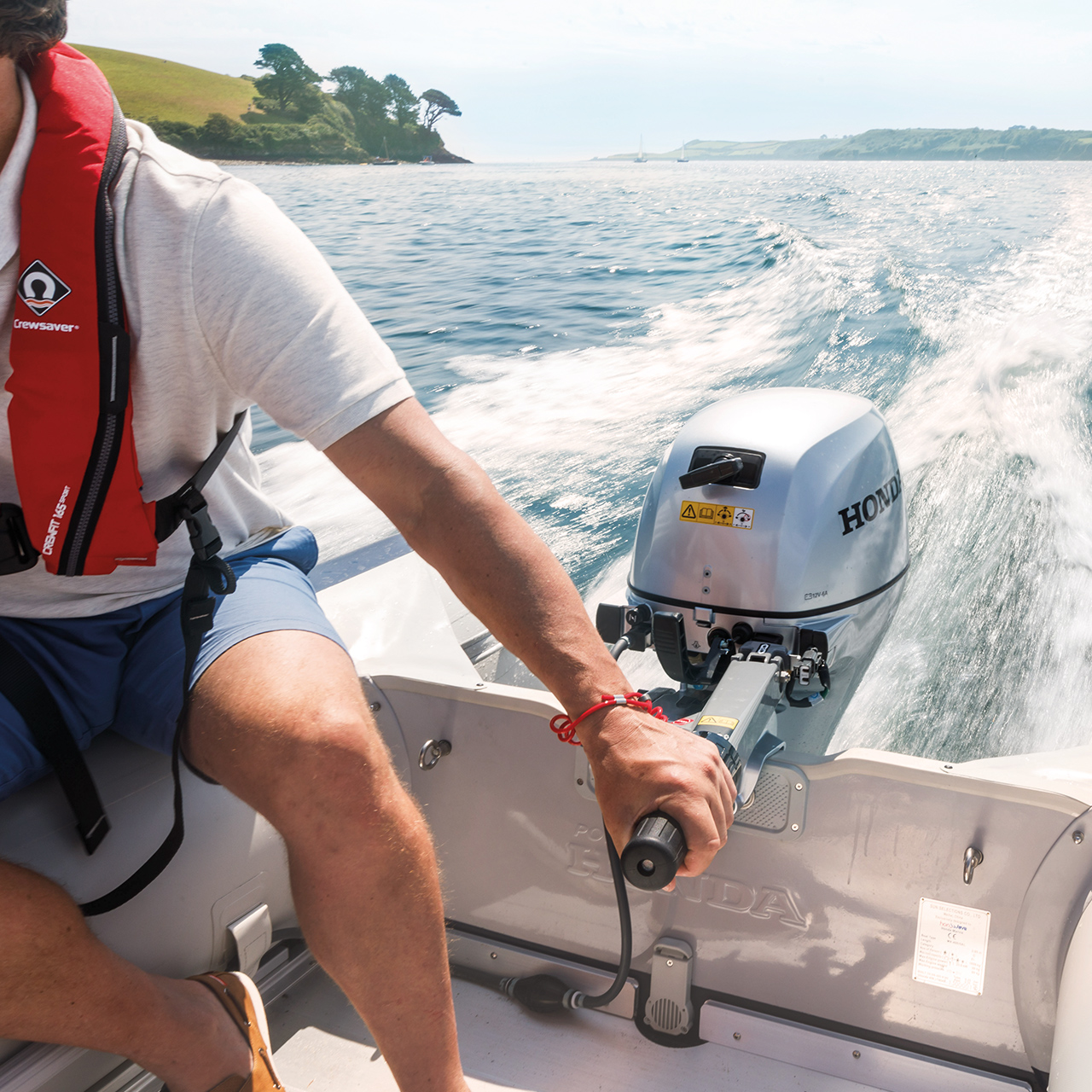Close up of Honda BF engine being used in lake location,
