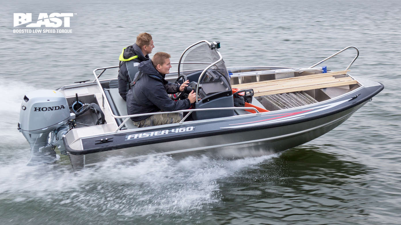 side view of two men steering a boat powered by a honda marine engine