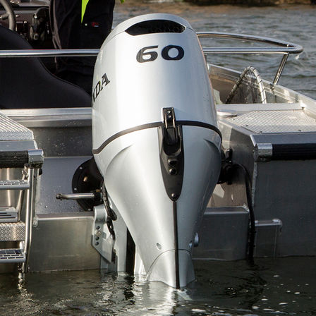 close up of the rear of a boat powered by a 60 horsepower honda marine engine