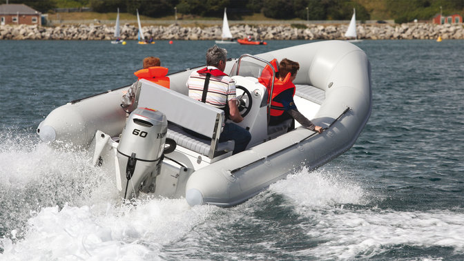 rear angled people on a boat fitted with a 60 horsepower honda outboard engine