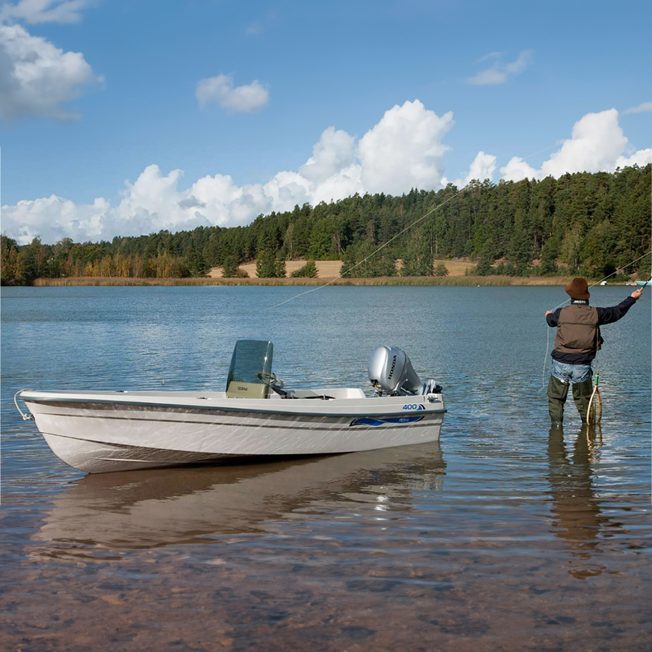 Model fishing in the lake with boat nearby showcasing the BF8-10 engine.