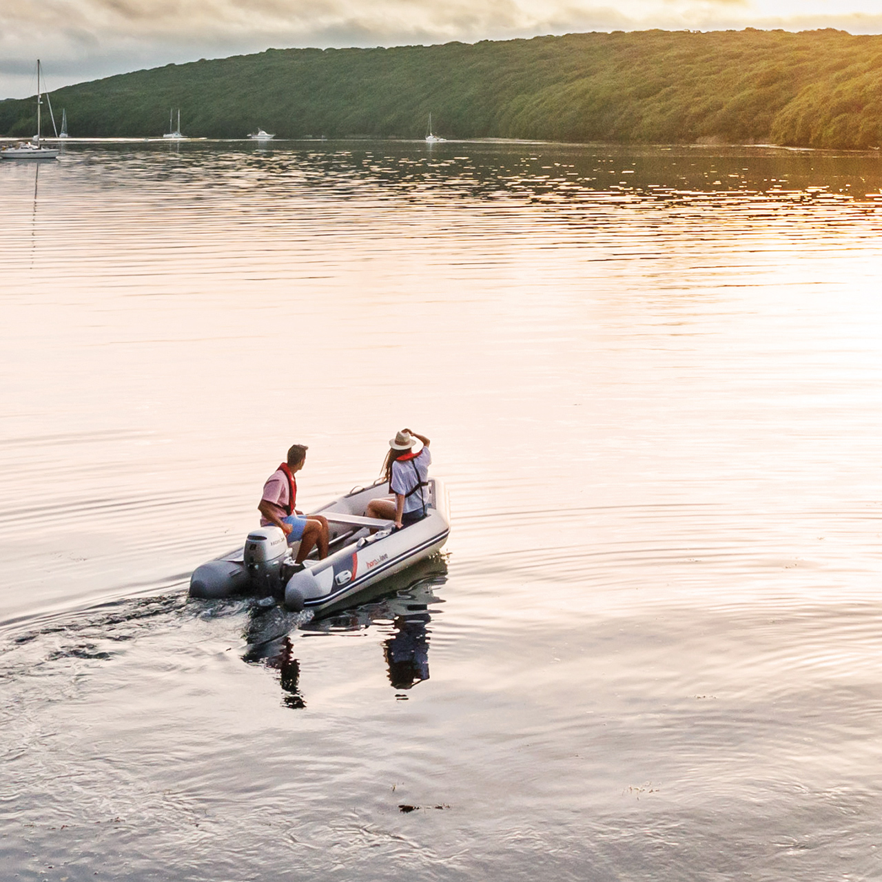 Couple on boat in the lake with a Honda BF8-10 engine.